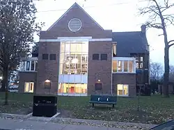 Two storey building of triangular shape around an entrance archway