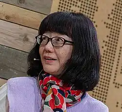cropped headshot of Kawakami speaking at 2023 LiteratureXchange Festival