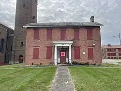 This circa 1840 I-house was the first building constructed on the Holy Rosary property and went on to serve as the parish rectory.