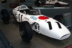 Photo taken from the front of the Honda RA272, a white tubular chassis