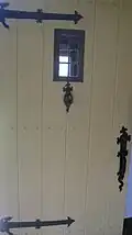 Front door with wrought-iron fixtures