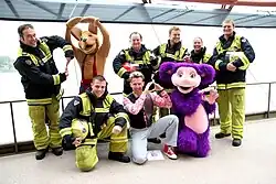 Members of the Hooley Dooleys with firefighters of Fire and Rescue NSW in 2007