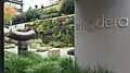 The sculpture is installed along Hotel Modera's outdoor spaces and adjacent sidewalk.