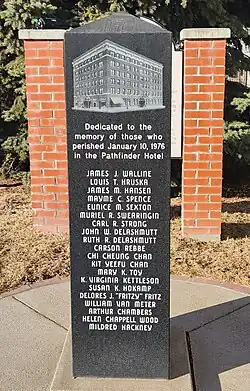 The Hotel Pathfinder memorial, a black marble statue surrounded by bricks on the left and right sides with an engraved photo of the hotel and the engraved names of those who died either in the explosion, or in the hospital following.