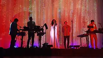 How to Destroy Angels performing in April 2013; from left to right: Alessandro Cortini, Atticus Ross, Mariqueen Maandig, Trent Reznor, and Rob Sheridan