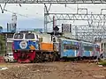 Taksaka train passing in Manggarai heading to Gambir during using the Hype Trip livery, 2022