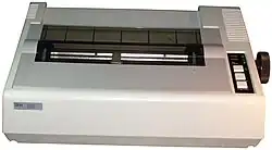 A beige, IBM-branded dot matrix printer
