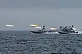Rocket-armed Speedboats firing rockets on the Nimitz replica.