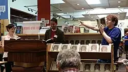 At Powell's Bookstore in Beaverton, Oregon. Doescher (center) does a reading of The Jedi Doth Return with former classmate Anne Huebsch (left) and audience member Micah Read from Lincoln High School (right). July, 2014.