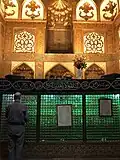 A devotee at the grave, praying to Ismail