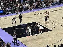 A player on the San Francisco Valkyries takes a free throw during a WNBA game at Chase Center as teammates and opponents line up for the rebound.