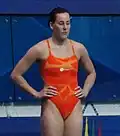 A woman wearing a one-piece swimsuit