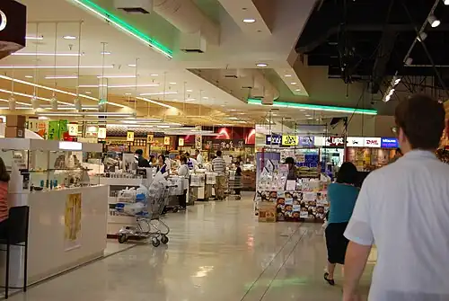Inside the former Torrance location. The grocery store is to the left, the main food court upper right, and specialty stores selling books and videos lower right.