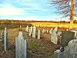 Inside the Penns Neck Cemetery, Jan. 21, 2022. In the distance are dirt mounds created during the construction of Princeton University's "West Windsor Meadows Neighborhood" campus.