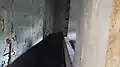 A look at the interior of the pillbox through a gap behind the entrance-door.