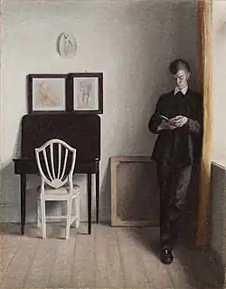 Vilhelm Hammershøi (1864–1916) Interior with Young Man Reading, 1898