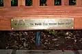The bench's bottom plaque