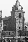 Inverkeithing War Memorial with St Peter's Church in background.