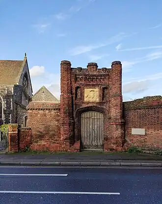 Tudor gatehouse made from worn brick and stone