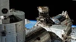 IDA-3 (white) attached to the top of PMA-3 (black), which is attached to the zenith berth of the Harmony module