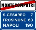 End of urban area, with distances to other towns (end of 50&nbsp;km/h speed limit and of the prohibition of using horn)