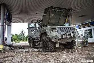 A destroyed green Russian vehicle