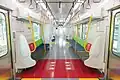Interior with priority seating marked with red seatback and flooring