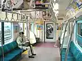 Interior view of SaHa E231-4600 car, showing E233 series derived interior, April 2010