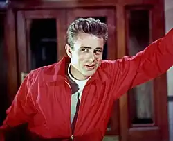 Film icons like James Dean (pictured), Marilyn Monroe, Marlon Brando, Audrey Hepburn, John Wayne, Elizabeth Taylor, Charlton Heston, Grace Kelly, and James Stewart, embodied new ideals of youth rebellion, glamour, and modern style.
