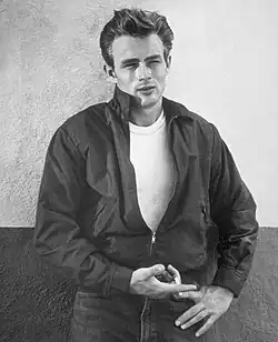 A black-and-white photo of Dean wearing a bomber jacket and Lee jeans