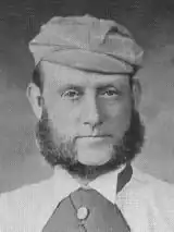 A black and white photo of a man's face