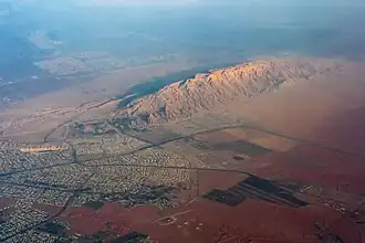 Aerial view of Jebel Hafeet, city of Al Ain, and areas of the Arabian desert