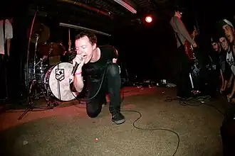 Jeremy Bolm performing live with Touché Amoré in 2012.