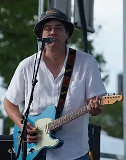 Valenzuela performing with Gin Blossoms in 2013