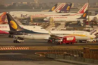 Many jet planes at a terminal