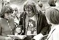 Signing autographs after a concert