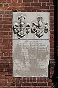 Gravestone slab in the basilica wall
