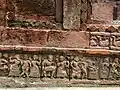 A drummer with a group of dancing women.