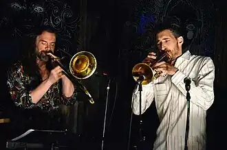 Mclean playing trumpet (right)