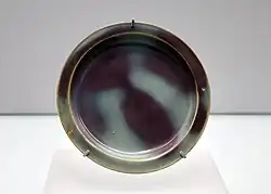 Jun ware dish with sky-blue glaze and purple splashes, Jin dynasty. Shanghai Museum.