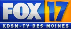 From top left: A blue box with the Fox network logo in white. Next to it is a gold square containing a numeral 17 in a sans serif. Below is another blue box with the words "K D S M-TV Des Moines", widely tracked, also in a sans serif, in white.