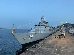 KD Lekiu docked at RMN Lumut Naval Base at night.
