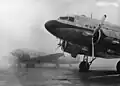 KLM Douglas DC-3 at Schiphol, Behind it is British European Airways Douglas DC-3 (G-AHCT), December 28, 1946