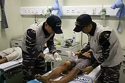 KRI dr. Radjiman Wedyoningrat (992) medical personnel evacuate and treat victims of sinking ship KM Maju Jaya, in the northern waters of Bangka Island, Friday, 11 July 2025.