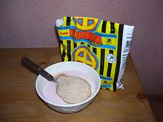 The making of kama, a traditional dish prepared by soaking and mixing a combination of milled and roasted cereal and legume flours (kamajahu) in milk or buttermilk and eaten uncooked.