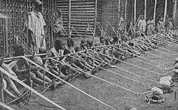 Children in Cameroon weaving, 1919.