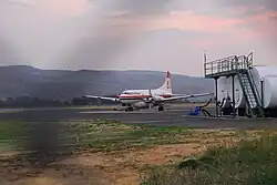 An airplane sits on a runway.