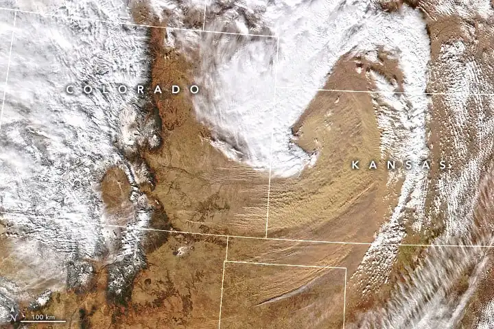 Due to gusty winds caused by a low-pressure system, winds had swept dust into southeastern Colorado and western Kansas.