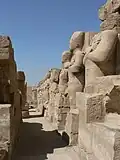 Osirid statues, likely of Thutmose I, at the Amun-Re temple in Karnak (in the Wadjet Hall). The head of the statue on the right of the image was removed in modern times and is currently located at the British Museum