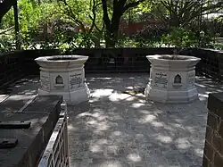 Kasturba Gandhi Memorial Stone (One on the right) with the memorial stone of Mahadev Desai in the palace where she died.